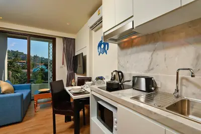 a kitchen with a sink and a counter top at The Aristo Beach by Holy Cow, studio, construction view in Surin Beach