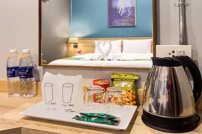 a coffee maker on a counter in a room with a bed at Memory Boutique Patong in Patong Beach
