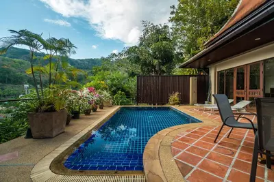 a swimming pool in the middle of a yard at Pool villa at Nakatani Village by Lofty in Kamala Beach