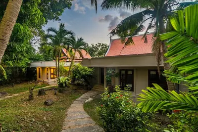 a house with a pathway in front of it at Pool villa at Nakatani Village by Lofty in Kamala Beach