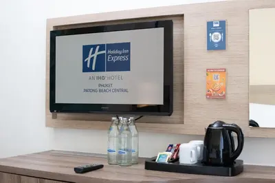 a flat screen tv sitting on a shelf in a hotel room at Holiday Inn Express Phuket Patong Beach Central by IHG in Patong Beach