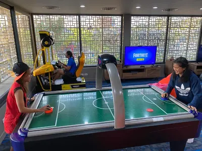 two women playing a game of ping pong at Anantara Vacation Club Mai Khao Phuket in Mai Khao Beach