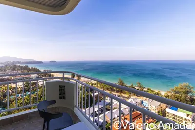 a balcony with a view of the ocean at Waterfront Karon Beach by PHR in Karon Beach