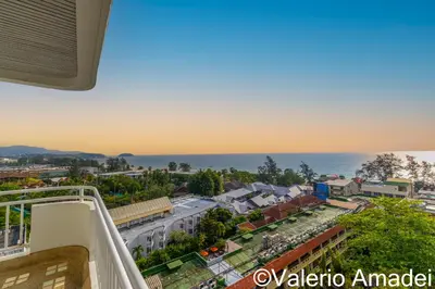 a view of a city from the balcony of a building at Waterfront Karon Beach by PHR in Karon Beach
