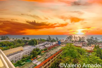 an overhead view of a city with a sunset at Waterfront Karon Beach by PHR in Karon Beach