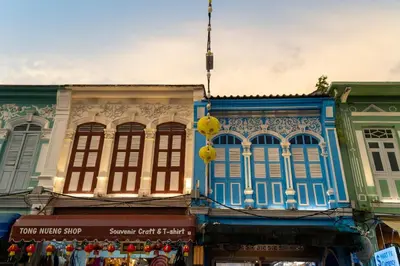 a group of buildings on a city street at Quip Bed & Breakfast in Phuket Town
