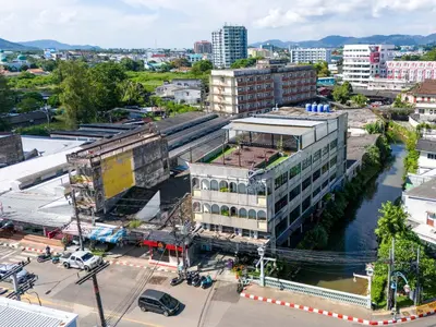 an aerial view of a city with a river and buildings at Quip Bed & Breakfast in Phuket Town