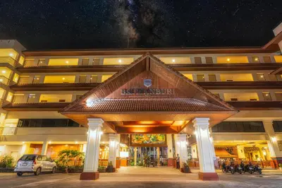 a building with a sign in front of it at Baumanburi Hotel Patong in Patong Beach