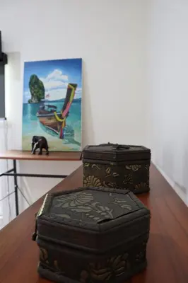 two boxes sitting on top of a wooden table at Relax private Pool Villas - 4 bedroom villas in Ao Nang Beach