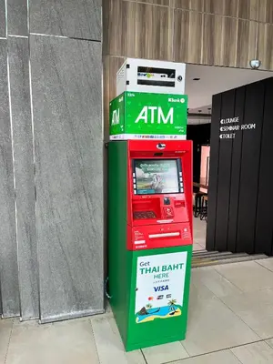 a red and green atm machine in a building at PRIME TOWN - Posh & Port Hotel PHUKET in Phuket Town