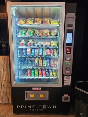 a refrigerator filled with drinks and soft drinks at PRIME TOWN - Posh & Port Hotel PHUKET in Phuket Town