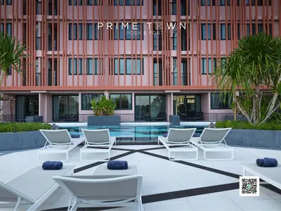 a group of chairs and tables in front of a building at PRIME TOWN - Posh & Port Hotel PHUKET in Phuket Town