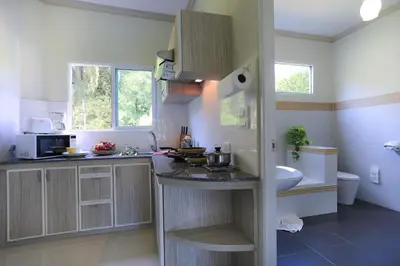 a kitchen with a sink and a counter top at Naka Resort in Kamala Beach