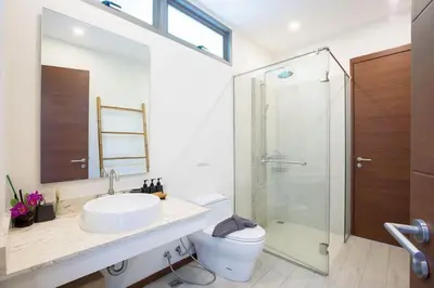 a bathroom with a toilet and a sink and a shower at VILLA Bangka 4BR Private pool villa Rawai in Rawai Beach