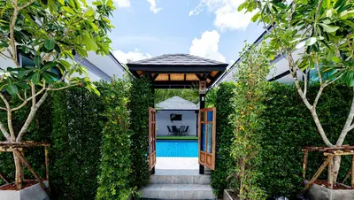 an entrance to a villa with a swimming pool at Lespalm Taraburi Pool Villa SHA Plus in Thalang