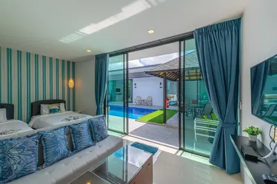 a hotel room with a bed and a balcony at Lespalm Taraburi Pool Villa SHA Plus in Thalang