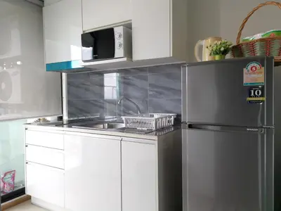 a kitchen with a sink and a refrigerator at 4 Floor - Centrio Condominium in Phuket town in Phuket Town