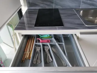 a kitchen drawer filled with utensils and a sink at 4 Floor - Centrio Condominium in Phuket town in Phuket Town