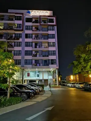 a tall building with cars parked in a parking lot at 4 Floor - Centrio Condominium in Phuket town in Phuket Town