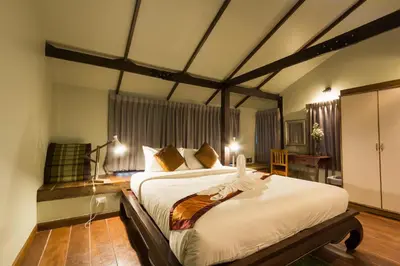 a bedroom with a large bed in a room at Kata Tranquil Villa - SHA Plus in Karon Beach