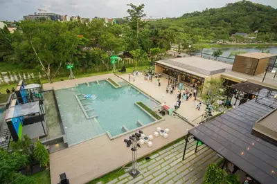 an overhead view of a swimming pool in a city at The Gallery Hotel Nai Harn in Nai Harn Beach