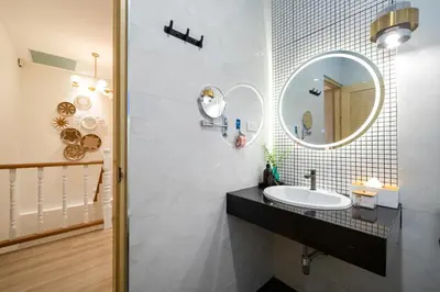 a bathroom with a sink and a mirror at Prime Patong-5BR-6BR pool villa See photo BEFORE BOOK in Patong Beach