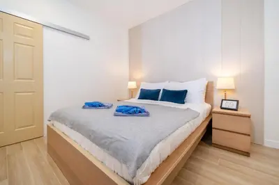 a bedroom with a bed with blue towels on it at Prime Patong-5BR-6BR pool villa See photo BEFORE BOOK in Patong Beach