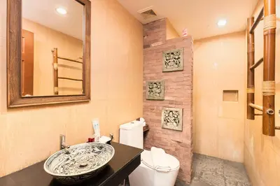 a bathroom with a sink and a toilet at Seeka Boutique Resort in Patong Beach