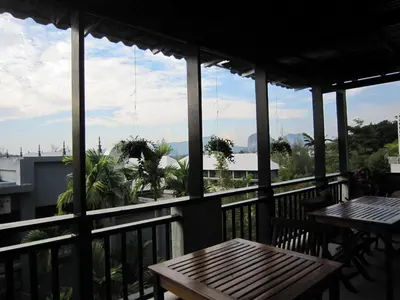 a balcony with tables and a view of the city at Royal Nakara Ao Nang in Ao Nang Beach
