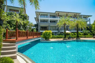 a swimming pool in front of a building at Pearl of Naithon in Nai Thon Beach