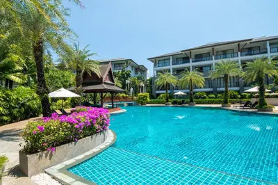 a swimming pool in front of a hotel at Pearl of Naithon in Nai Thon Beach