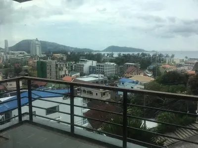 a view of a city from a balcony at WOW Apartment at Unity Patong in Patong Beach