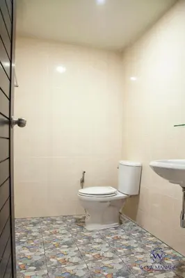 a bathroom with a toilet and a sink at Enjoy Sunset Rainbow Alley - WOW Townhouse at Patong Hill in Patong Beach
