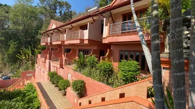 a building with plants on the side of it at Baan Kongdee Sunset Resort Kata in Kata Beach