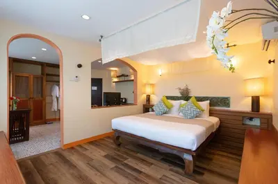 a bedroom with a bed in a room at Aochalong Villa Resort & Spa - SHA Plus in Chalong
