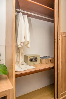a cupboard with a microwave and a radio at Aochalong Villa Resort & Spa - SHA Plus in Chalong