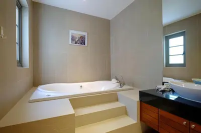 a large bathroom with a tub and a sink at Beautiful 3br 380sqm Pool Villa Walk To Bangtao Beach and Catch club in Bang Tao Beach