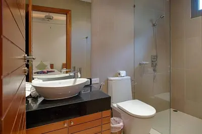 a bathroom with a sink and a toilet and a shower at Beautiful 3br 380sqm Pool Villa Walk To Bangtao Beach and Catch club in Bang Tao Beach