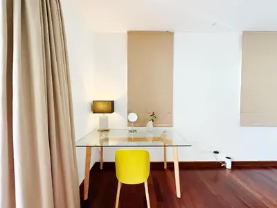 a glass table and a yellow chair in a room at Beautiful 3br 380sqm Pool Villa Walk To Bangtao Beach and Catch club in Bang Tao Beach