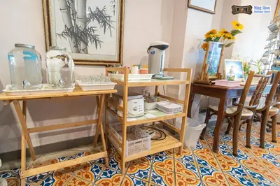 a room with two tables and two chairs at Ming Shou Boutique House in Phuket Town