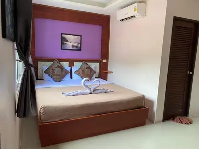 a bedroom with a bed with two hearts on it at Sabai House in Phi Phi Don