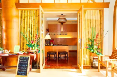 a kitchen and dining room with a table and chairs at Beyond Karon in Karon Beach