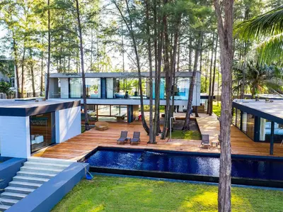 a house in the woods with a swimming pool at Grand Villa Noi in Natai Beach
