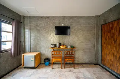 a dining room with a table and two chairs at UNOTEL Karon Beach in Karon Beach
