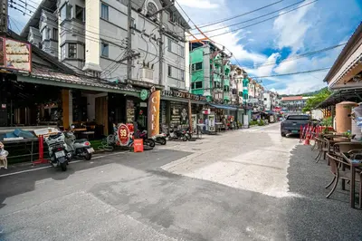 an empty street in a city with buildings at UNOTEL Karon Beach in Karon Beach