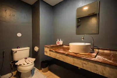 a bathroom with a sink and a toilet at UNOTEL Karon Beach in Karon Beach