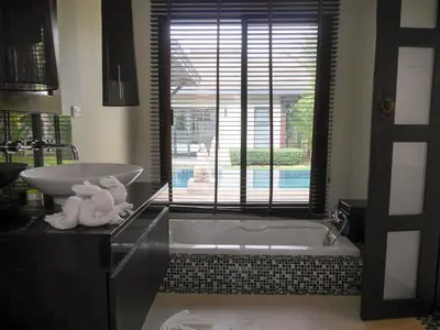 a bathroom with a tub and a sink at 3bdr Pool villa Naiharn KOK by Capital Pro in Rawai Beach