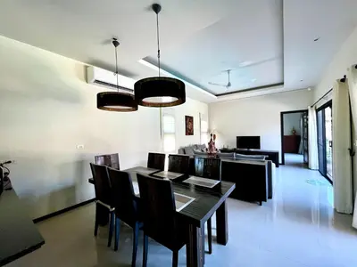 a dining room with a table and chairs at 3bdr Pool villa Naiharn KOK by Capital Pro in Rawai Beach