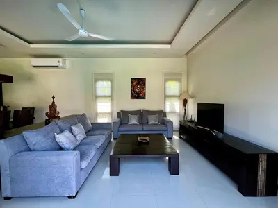 a living room with a couch and a coffee table at 3bdr Pool villa Naiharn KOK by Capital Pro in Rawai Beach