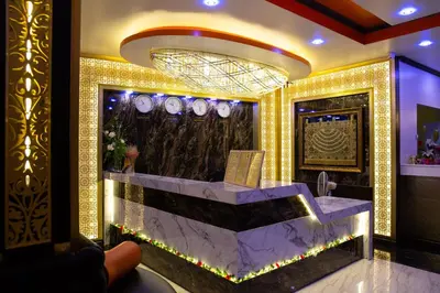 a lobby with a reception desk in a building at BAB ALHARA HOTEL in Patong Beach